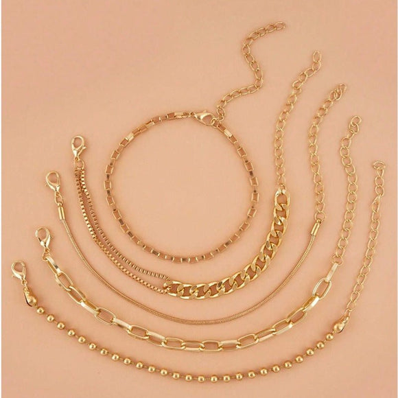 A golden six - piece set Chic Multi - Layered Alloy Bracelet Set - Fashionable Stackable Jewelry - RnR Galore